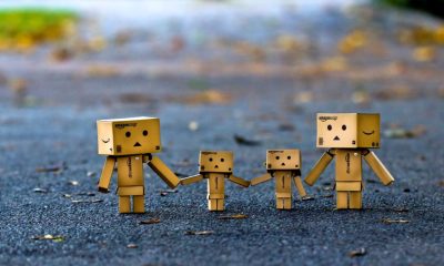 family two adult, two children family made from amazon delivery boxes